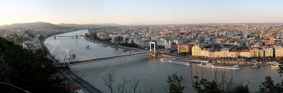 Evening sightseeing boat on the Danube with Buda Castle illuminated in the background, Budapest