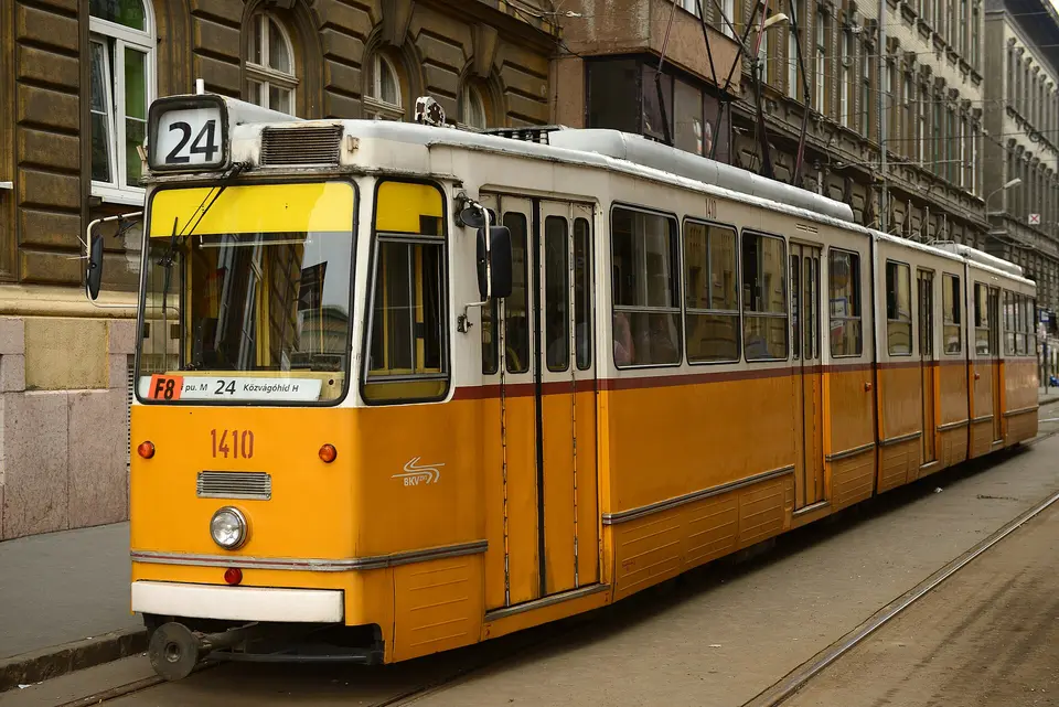 Traveler holding a Budapest Card at a metro station entrance in central Pest