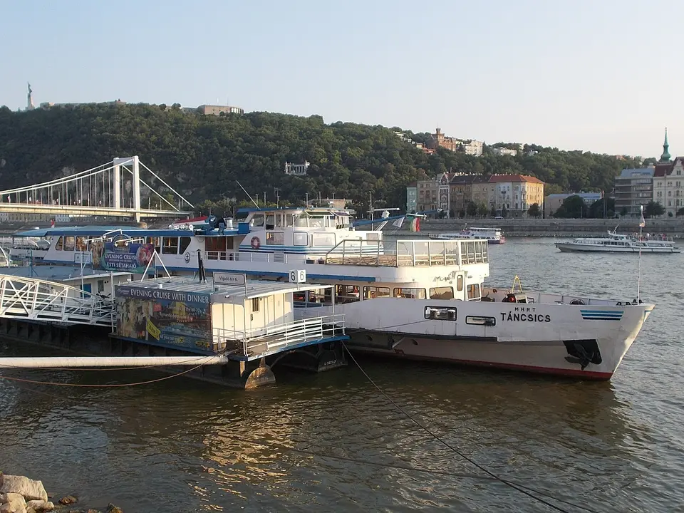Ticket kiosks and moored sightseeing boats on the Pest embankment of the Danube in Budapest