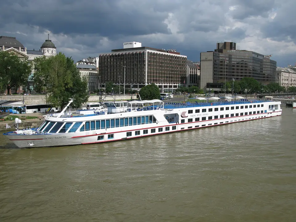 Viking river cruise ship docked on the Pest embankment of the Danube in Budapest at dusk